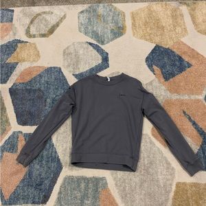 Dark grey crew neck with stitched on love in the corner, No rips no cuts on it